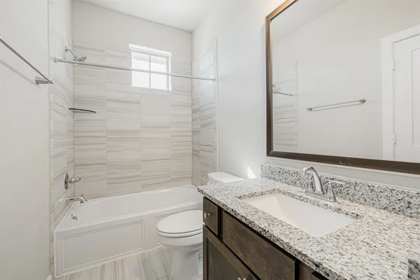 an empty room with a window and closet