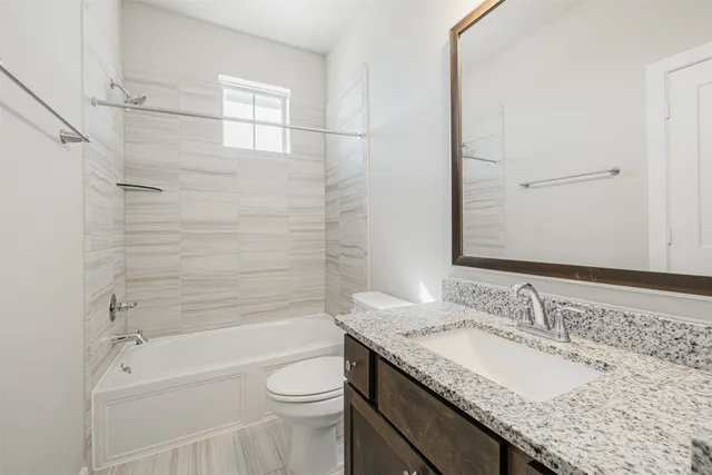 an empty room with a window and closet