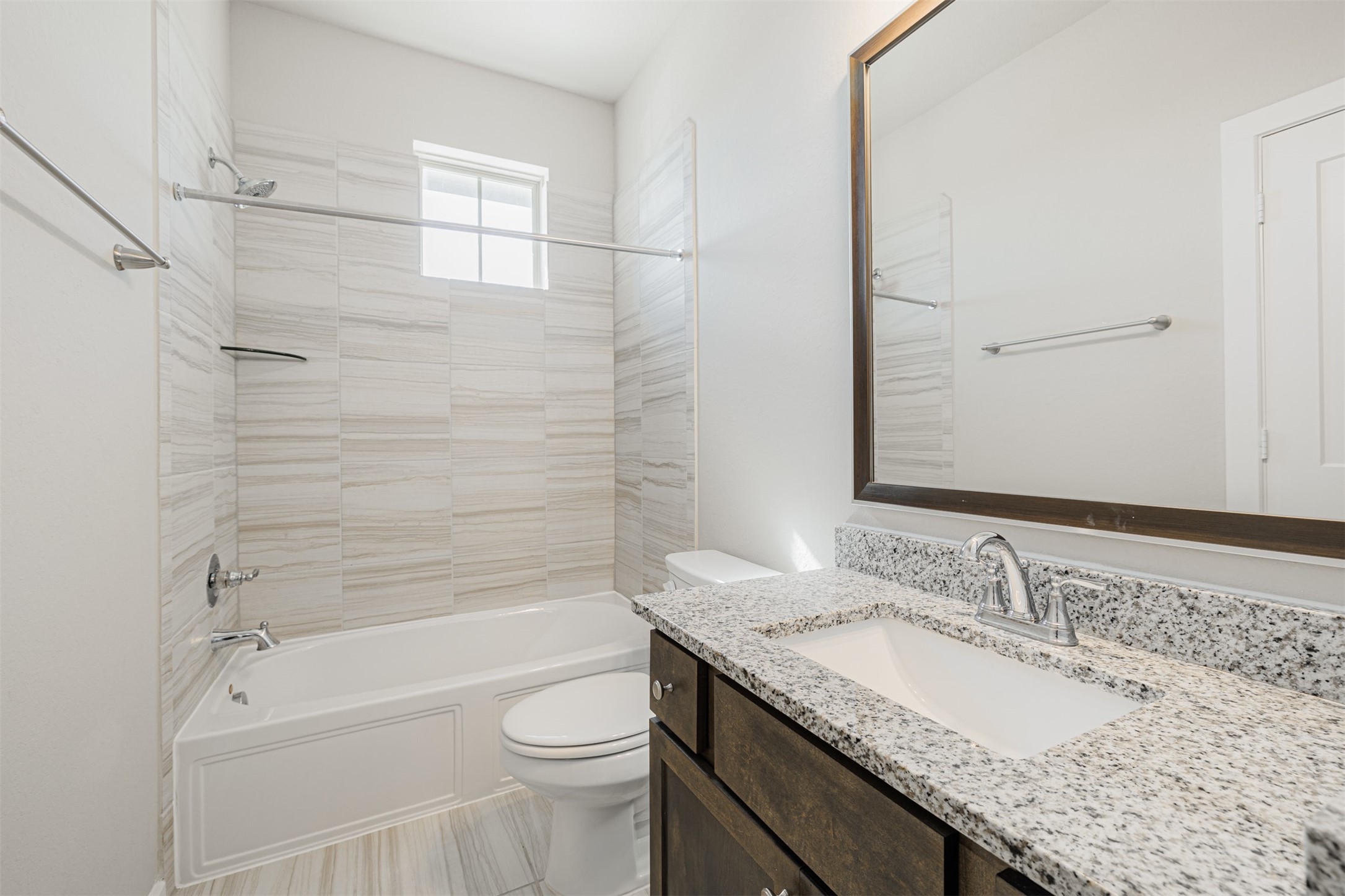 19622 Talley Valley Drive Cypress, TX 77433 - Photo 14 of 18 a bathroom with a granite countertop sink a toilet and bathtub
