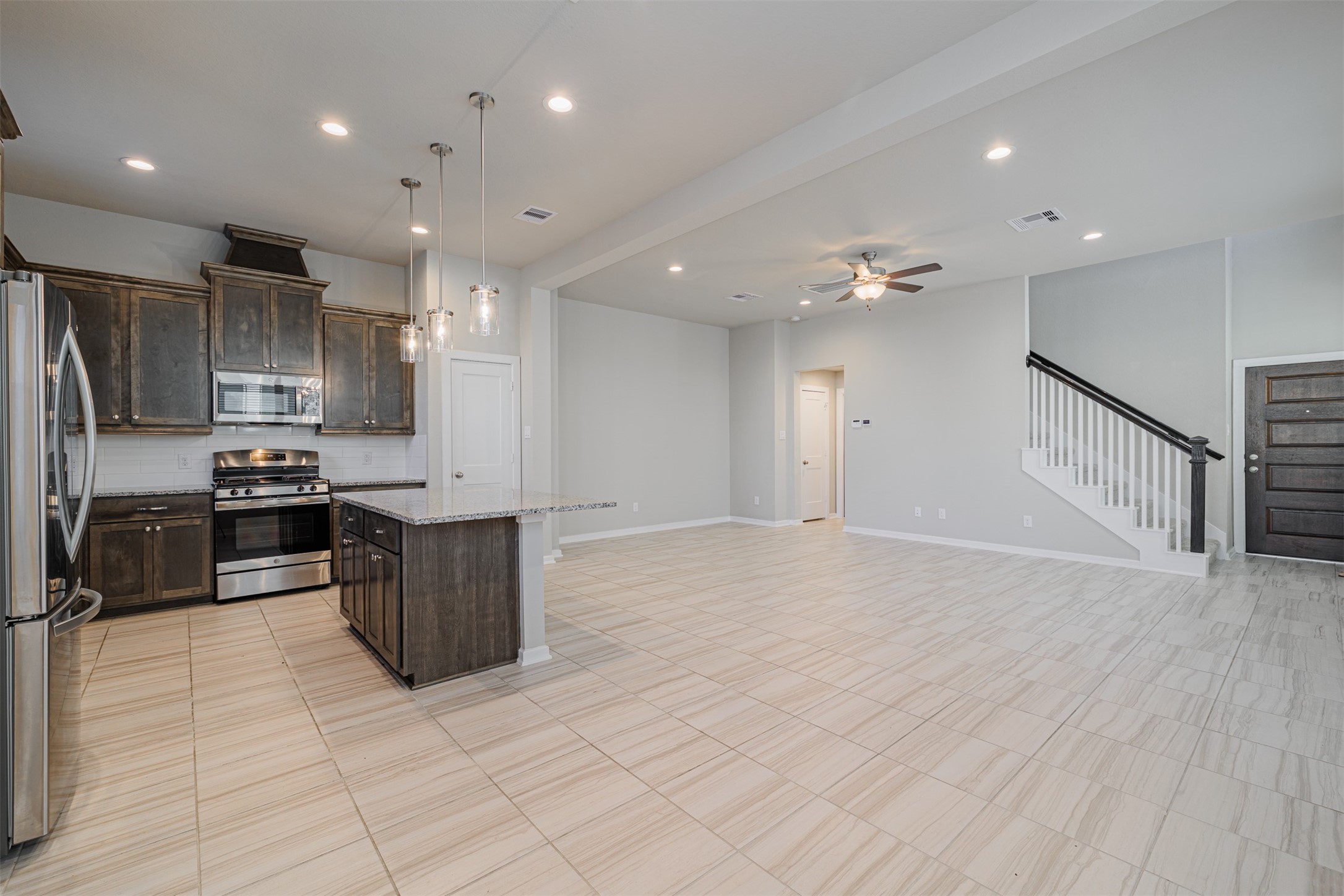 19622 Talley Valley Drive Cypress, TX 77433 - Photo 18 of 18 a kitchen with refrigerator and cabinets