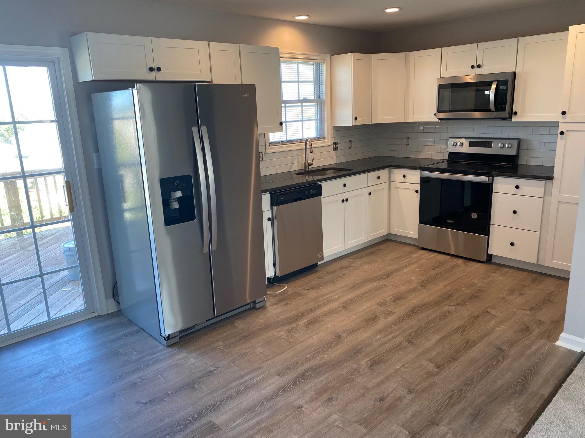 9 Fuzzy Tail Drive Ranson, WV 25438 - Photo 12 of 30 Kitchen is open to living room w/ LVP, recessed