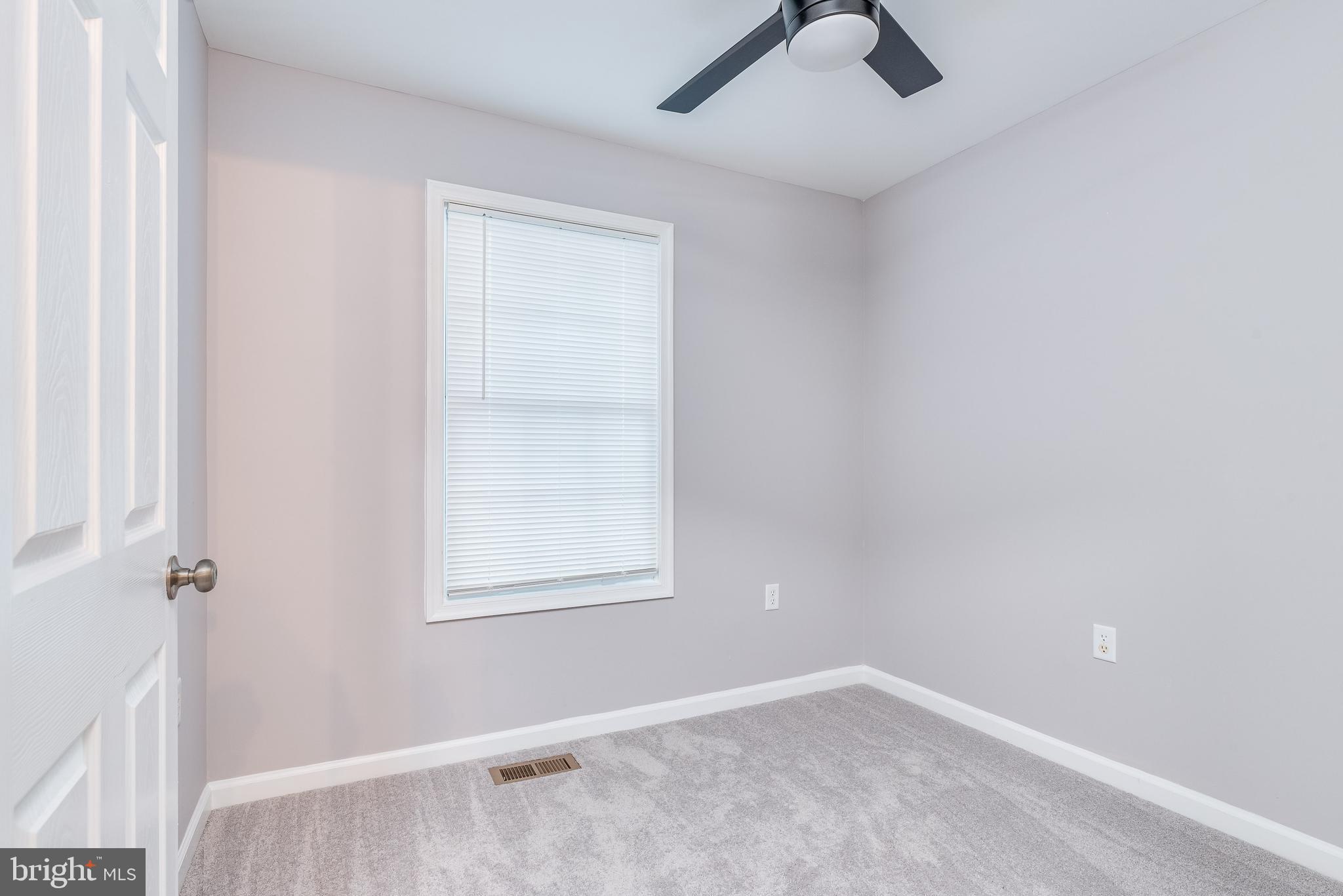 9 Fuzzy Tail Drive Ranson, WV 25438 - Photo 18 of 30 Bedroom 2 w/ carpet, ceiling fan and closet