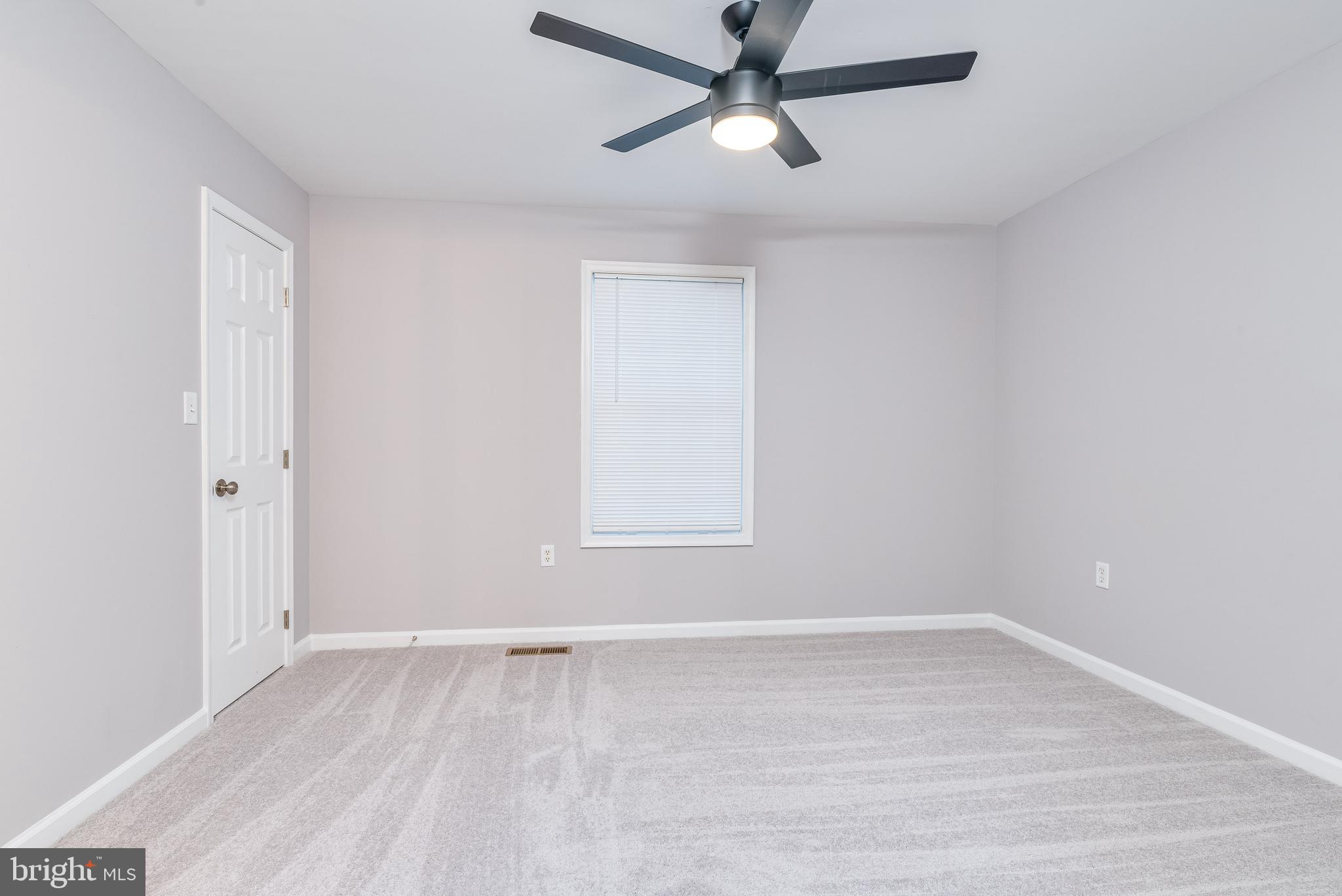 9 Fuzzy Tail Drive Ranson, WV 25438 - Photo 20 of 30 Large primary bedroom features new carpet and