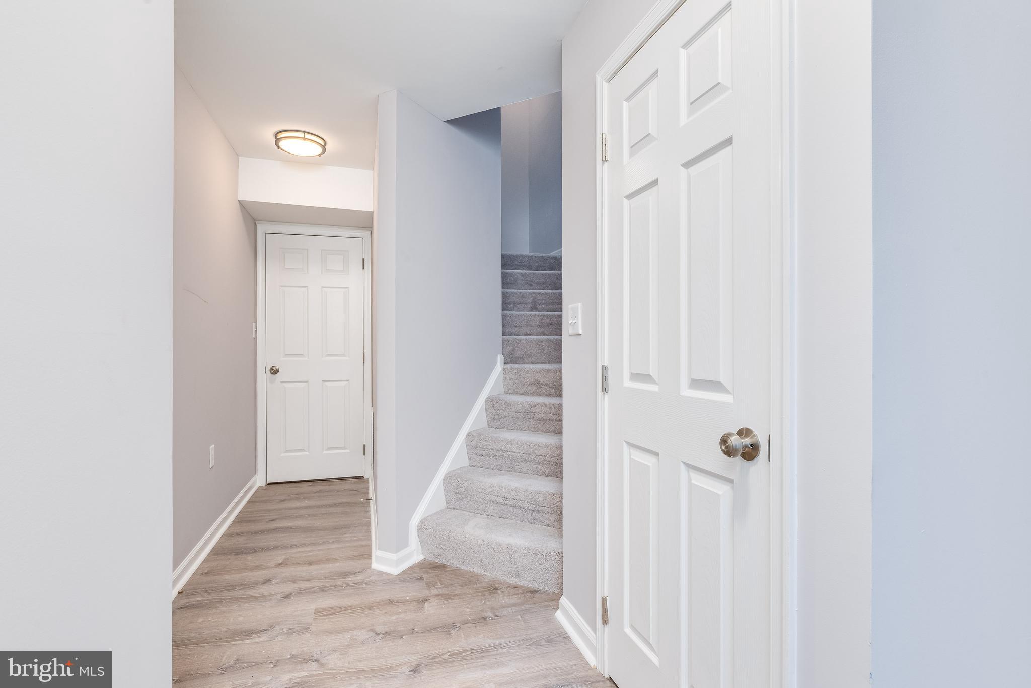 9 Fuzzy Tail Drive Ranson, WV 25438 - Photo 4 of 30 Bright hallway leads to family room