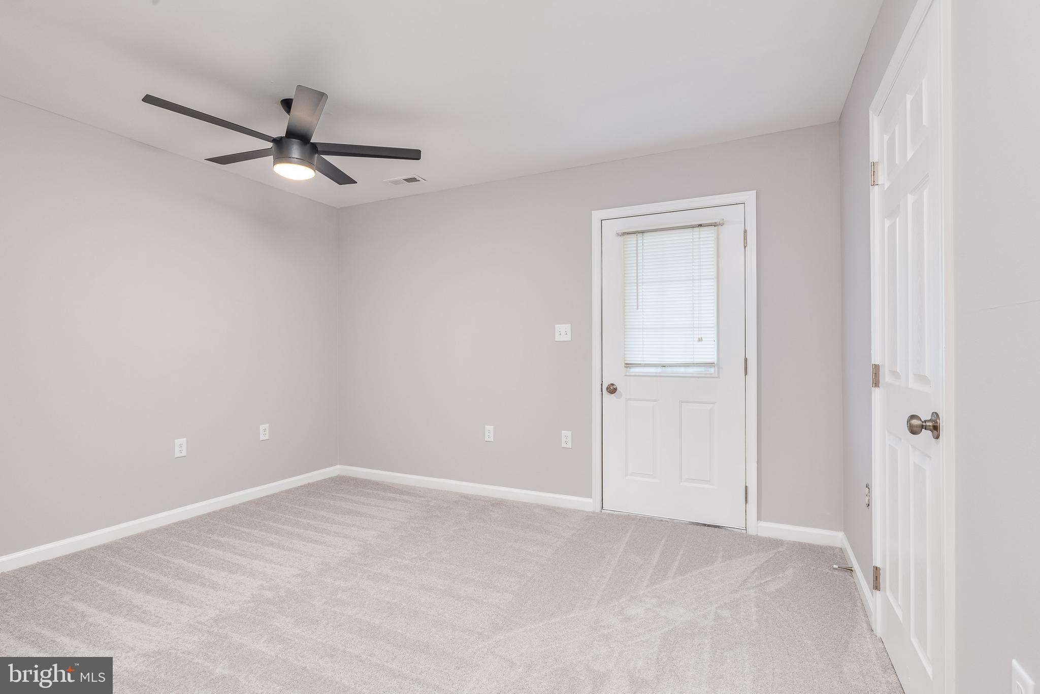 9 Fuzzy Tail Drive Ranson, WV 25438 - Photo 5 of 30 Large carpeted family room w/ yard access