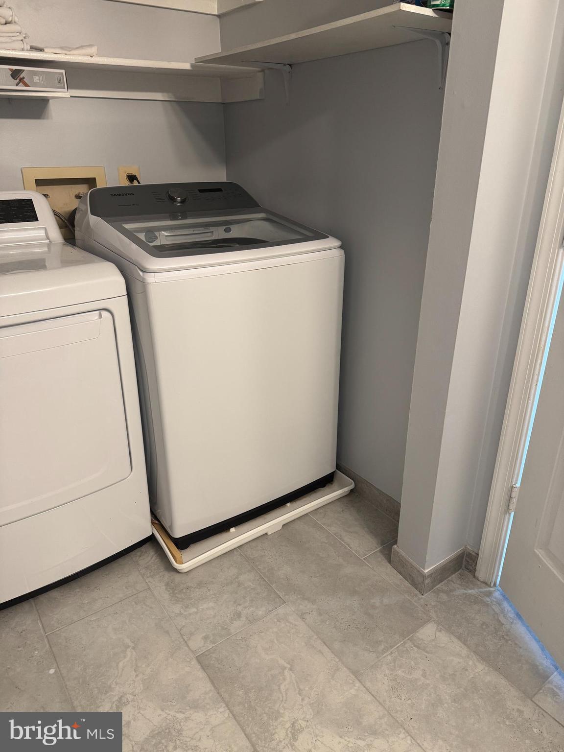 114 Prosperity Avenue Southeast, Unit C Leesburg, VA 20175 - Photo 18 of 18 a utility room with dryer and washer