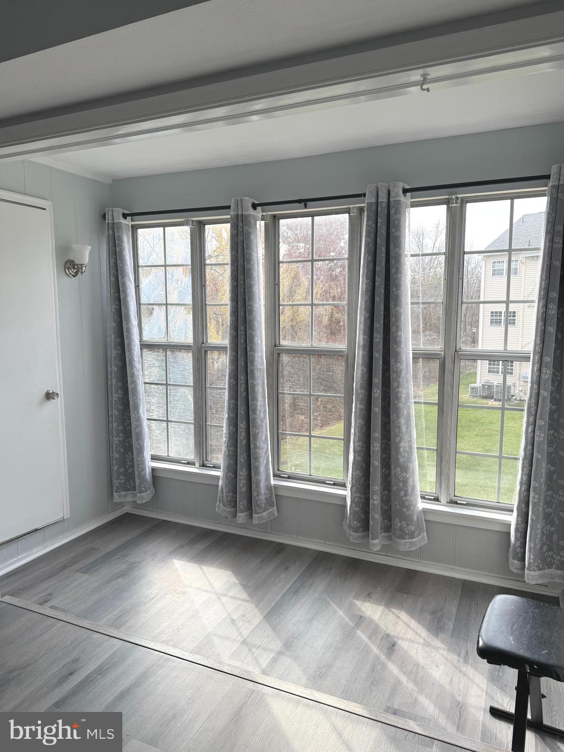 114 Prosperity Avenue Southeast, Unit C Leesburg, VA 20175 - Photo 5 of 18 a view of an empty room with a window