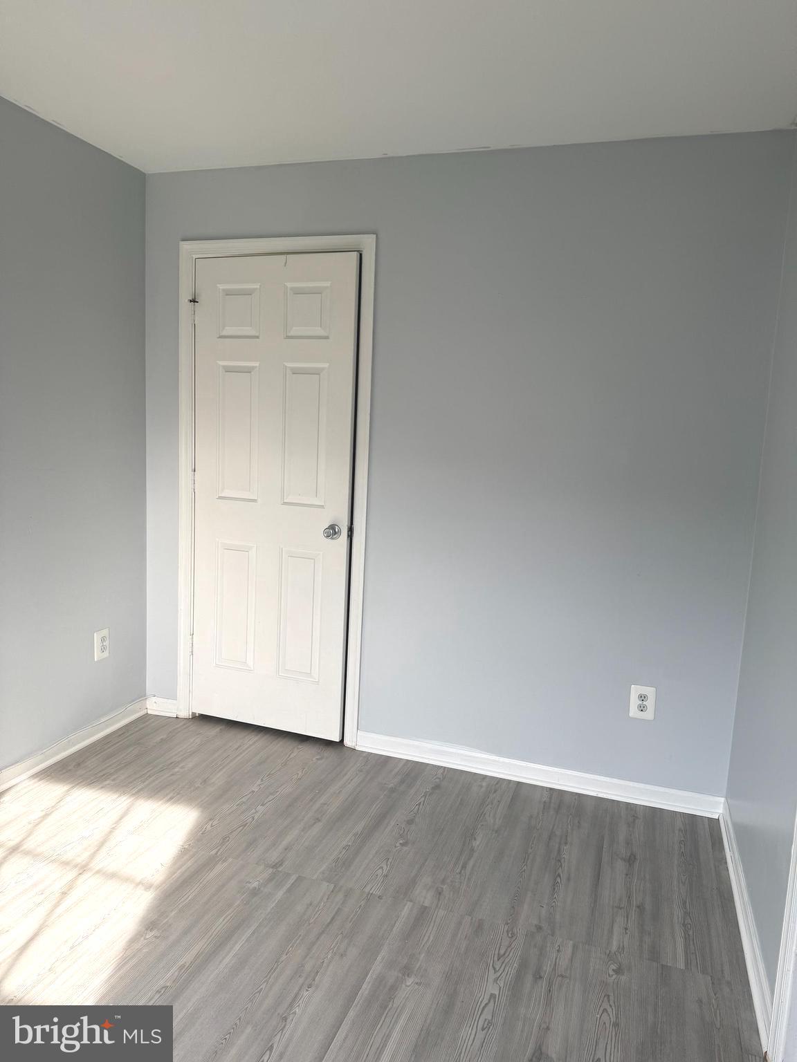 114 Prosperity Avenue Southeast, Unit C Leesburg, VA 20175 - Photo 9 of 18 a view of an empty room with wooden floor