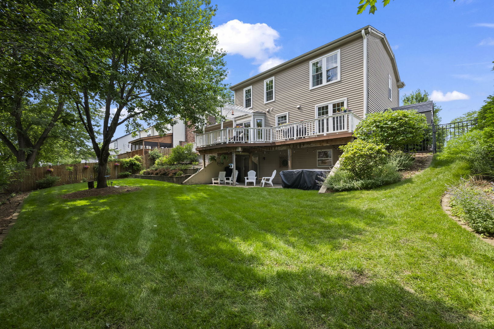 1565 Freeman Road Hoffman Estates, IL 60192 - Photo 8 of 46 a view of house with backyard and garden