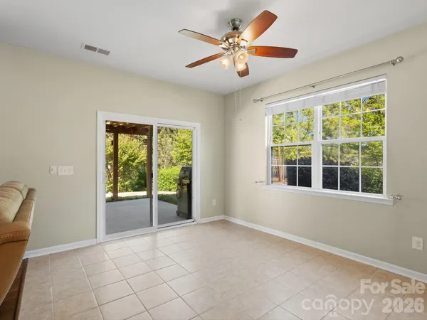 a large kitchen with stainless steel appliances granite countertop a sink and dishwasher a stove top oven with wooden floor