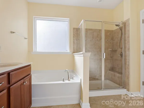 a bathroom with a glass shower door