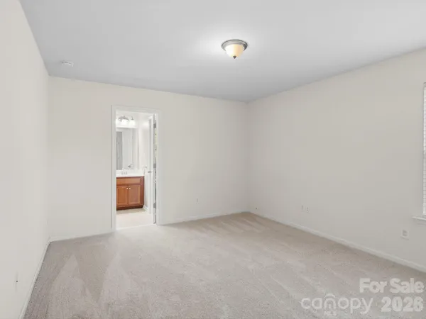 a view of a white house with a yard