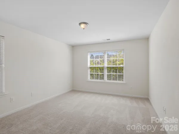 a front view of a building with garden