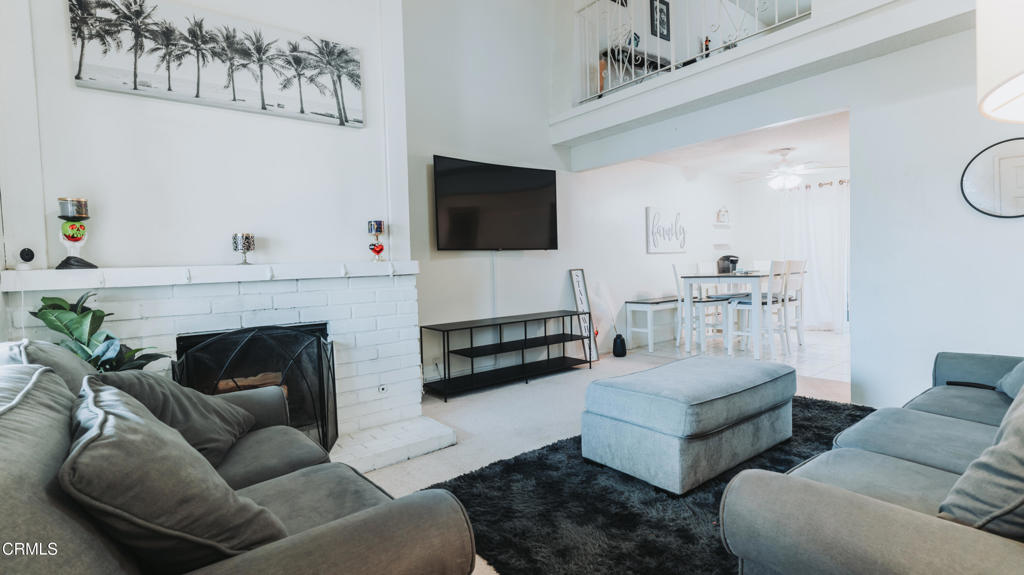 1020 Dunes Street Oxnard, CA 93035 - Photo 41 of 75 a living room with furniture and a fireplace