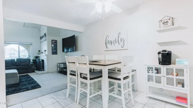 a spacious bedroom with a bed and a large window