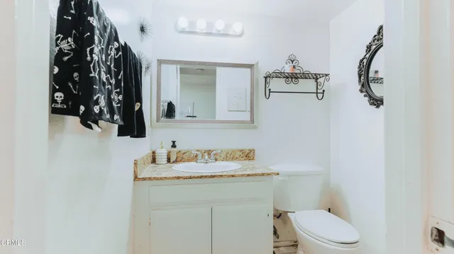 a view of a livingroom with furniture and a window