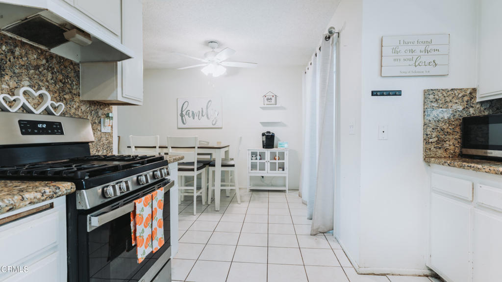 1020 Dunes Street Oxnard, CA 93035 - Photo 52 of 75 a kitchen with stainless steel appliances a stove a sink and a refrigerator