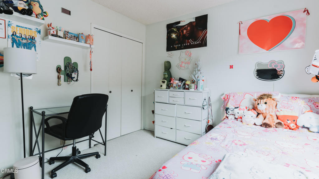 1020 Dunes Street Oxnard, CA 93035 - Photo 60 of 75 a bedroom with a bed and cabinets