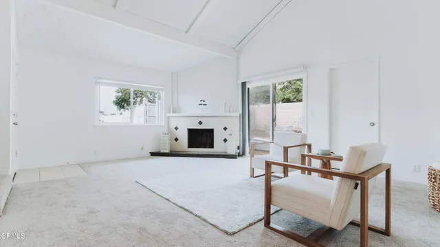 a kitchen with stainless steel appliances granite countertop a refrigerator and a stove
