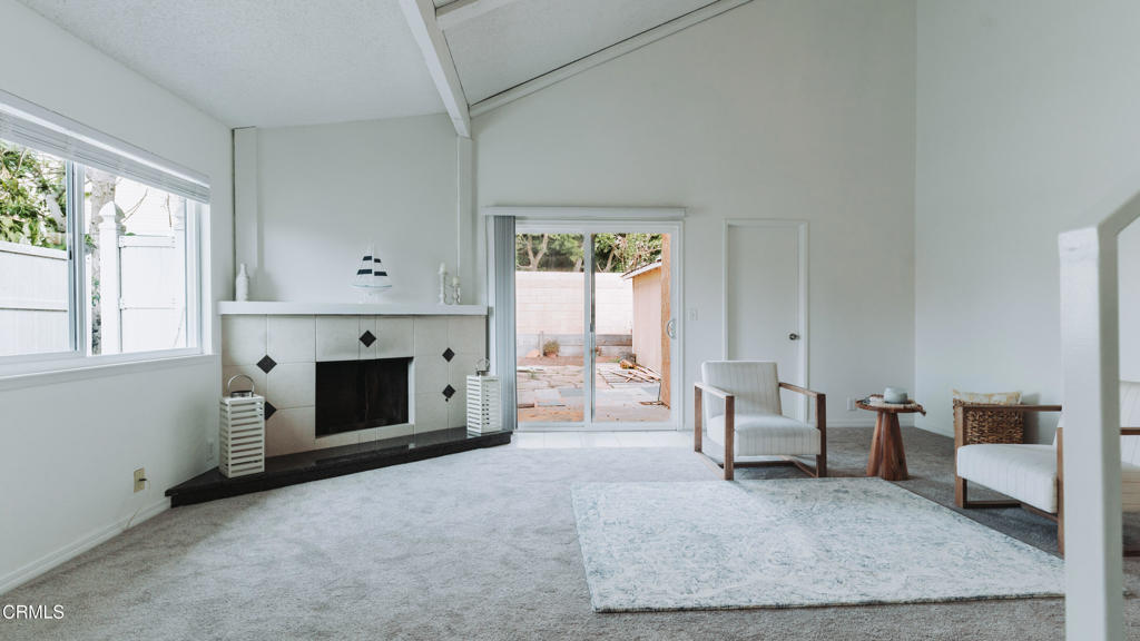 1020 Dunes Street Oxnard, CA 93035 - Photo 10 of 75 a living room with furniture and a fireplace