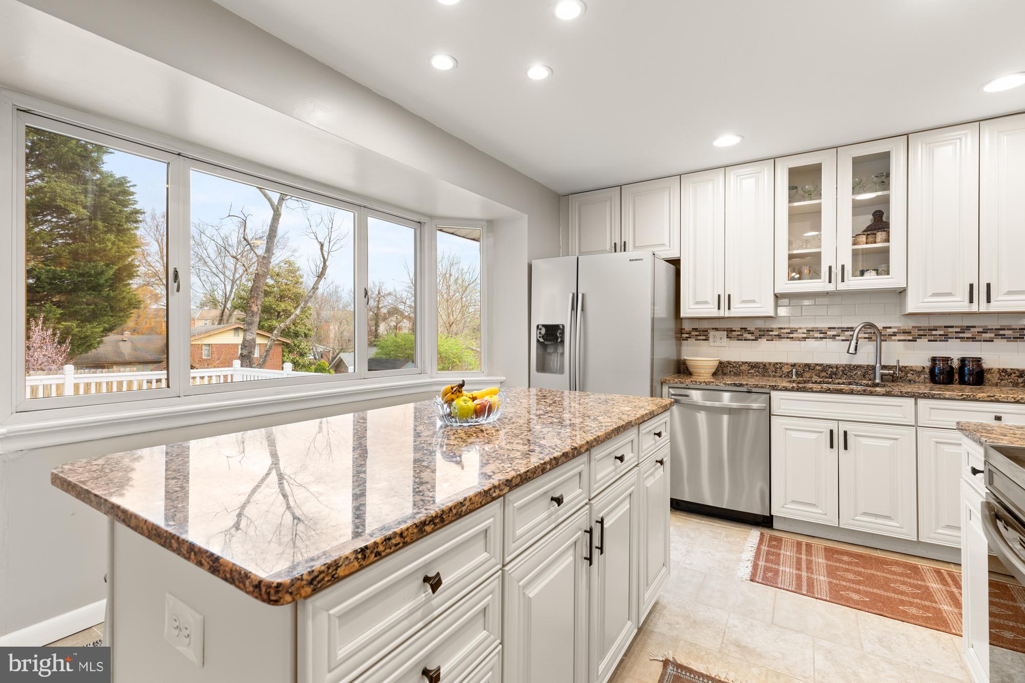 2407 Harmon Road Silver Spring, MD 20902 - Photo 11 of 39 a kitchen with stainless steel appliances granite countertop a refrigerator and a sink
