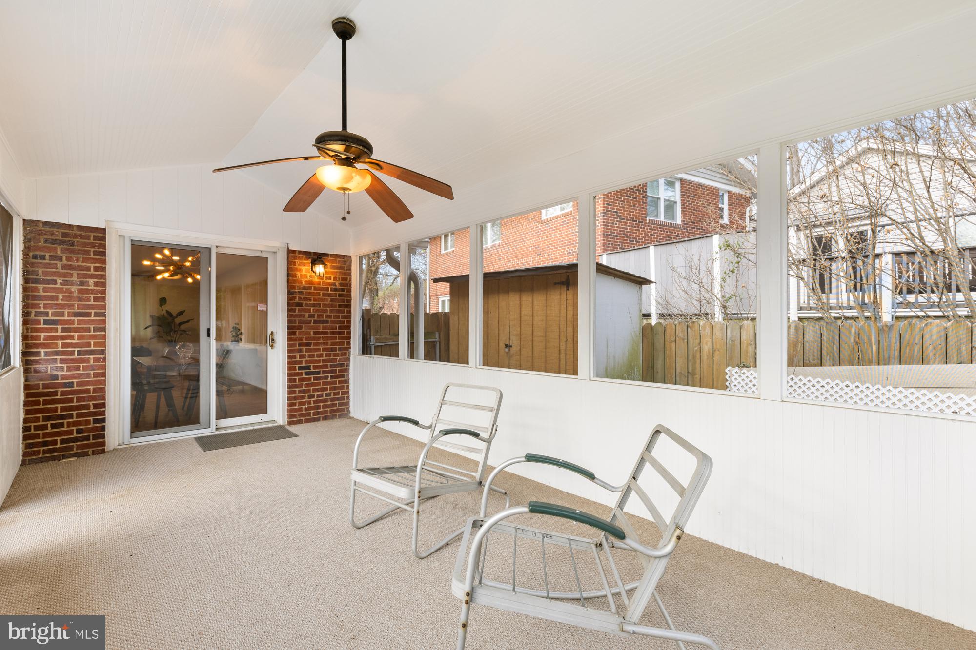2407 Harmon Road Silver Spring, MD 20902 - Photo 16 of 39 a dining room with furniture and a chandelier