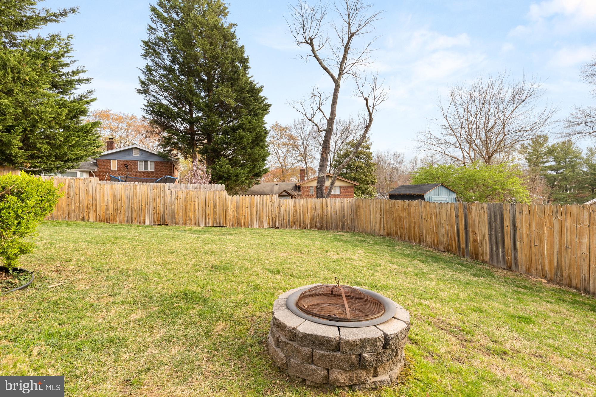 2407 Harmon Road Silver Spring, MD 20902 - Photo 18 of 39 a view of a backyard with table and chairs and wooden fence