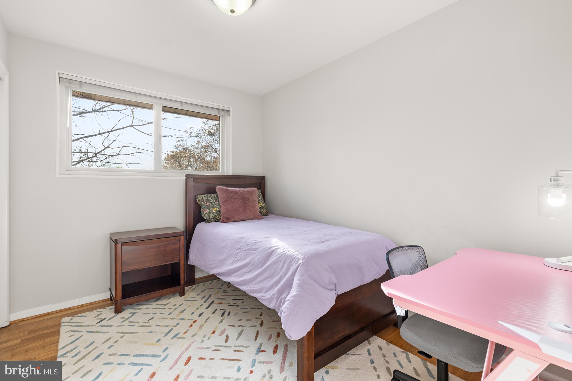 2407 Harmon Road Silver Spring, MD 20902 - Photo 21 of 39 a bedroom with two beds and a window