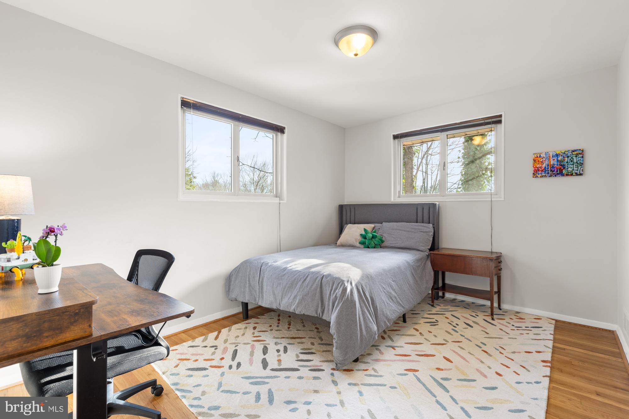 2407 Harmon Road Silver Spring, MD 20902 - Photo 22 of 39 a bedroom with a bed and a desk