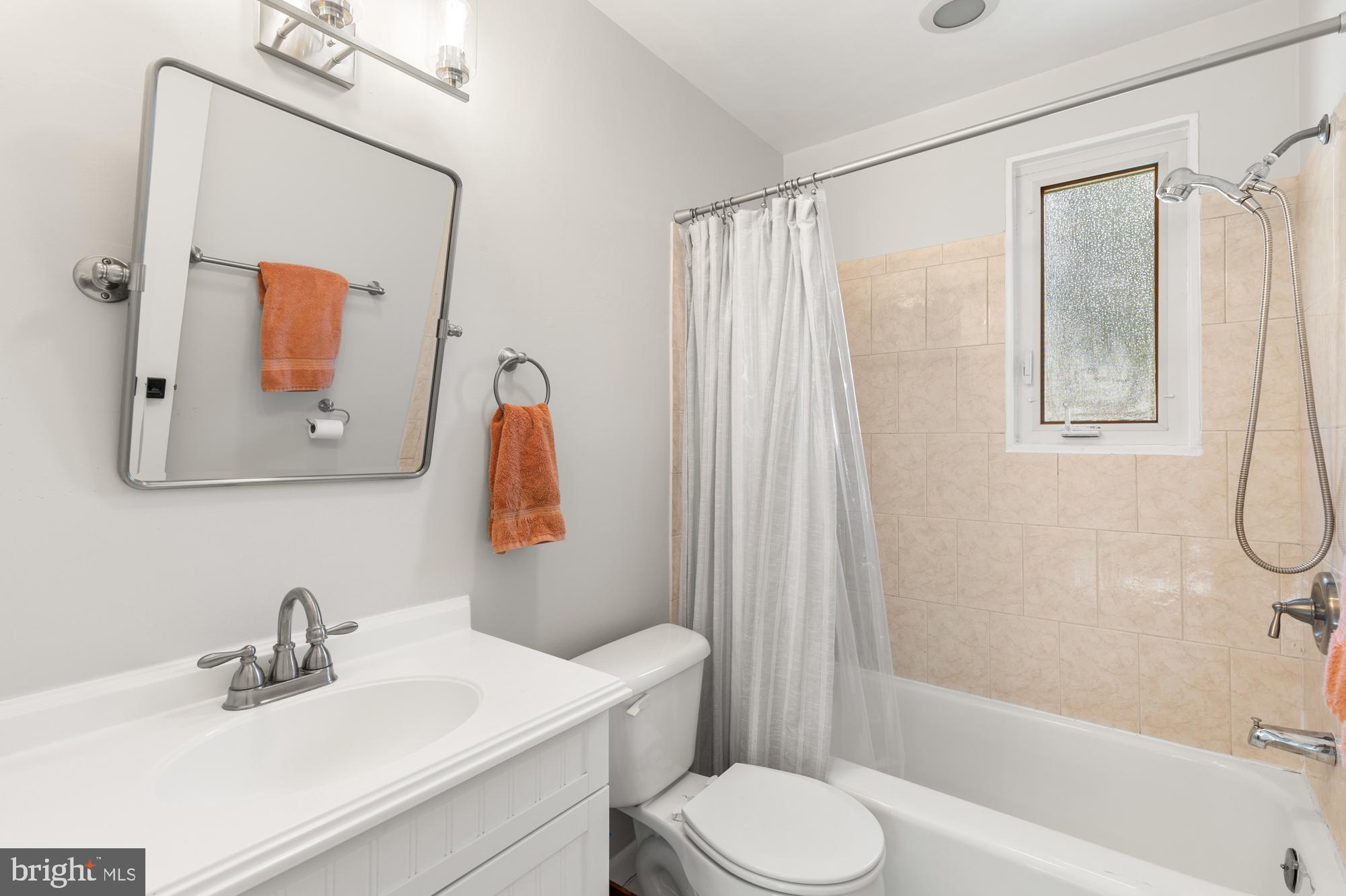 2407 Harmon Road Silver Spring, MD 20902 - Photo 24 of 39 a bathroom with a sink toilet and shower
