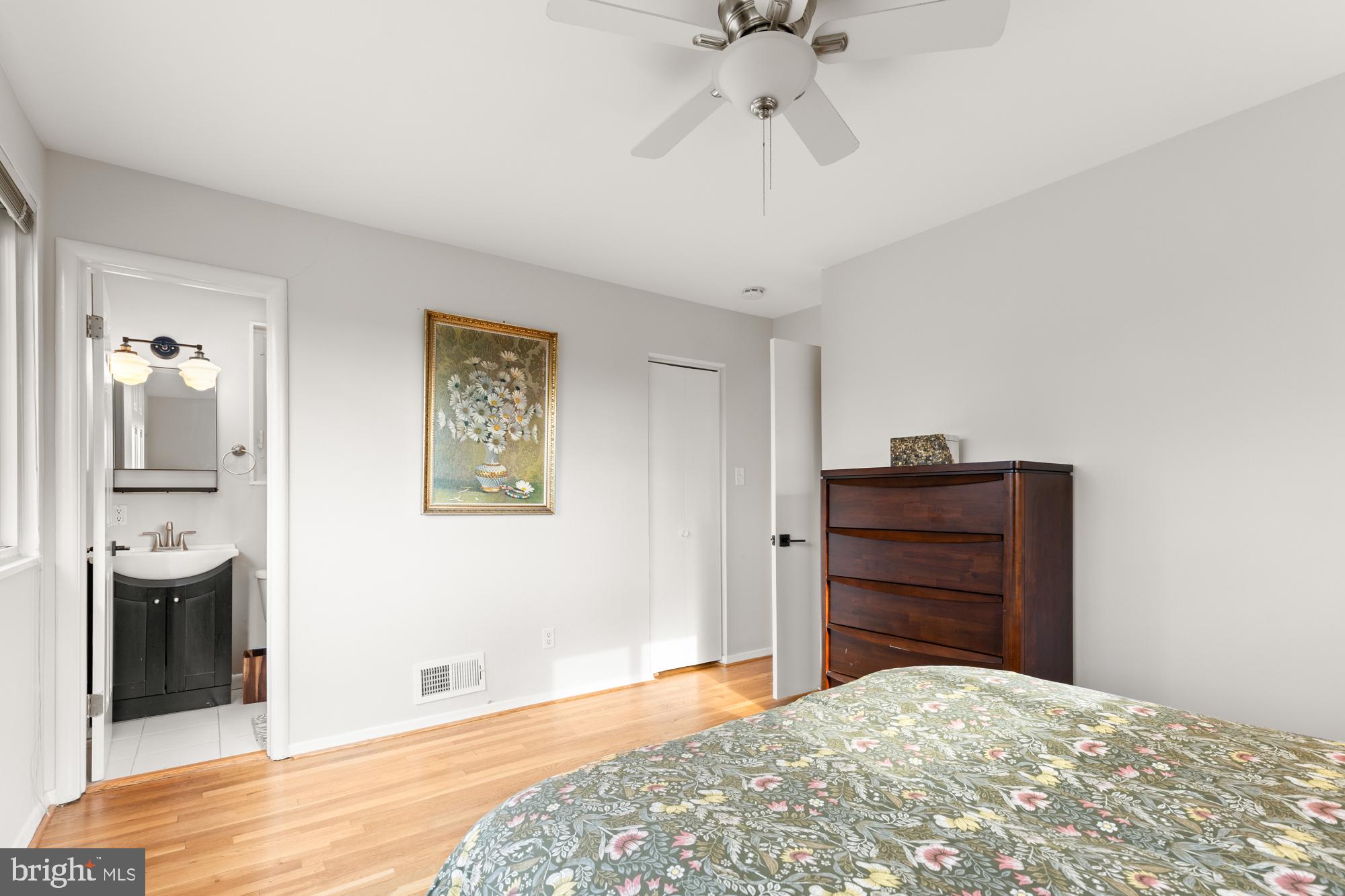 2407 Harmon Road Silver Spring, MD 20902 - Photo 27 of 39 a bedroom with a bed and a chandelier