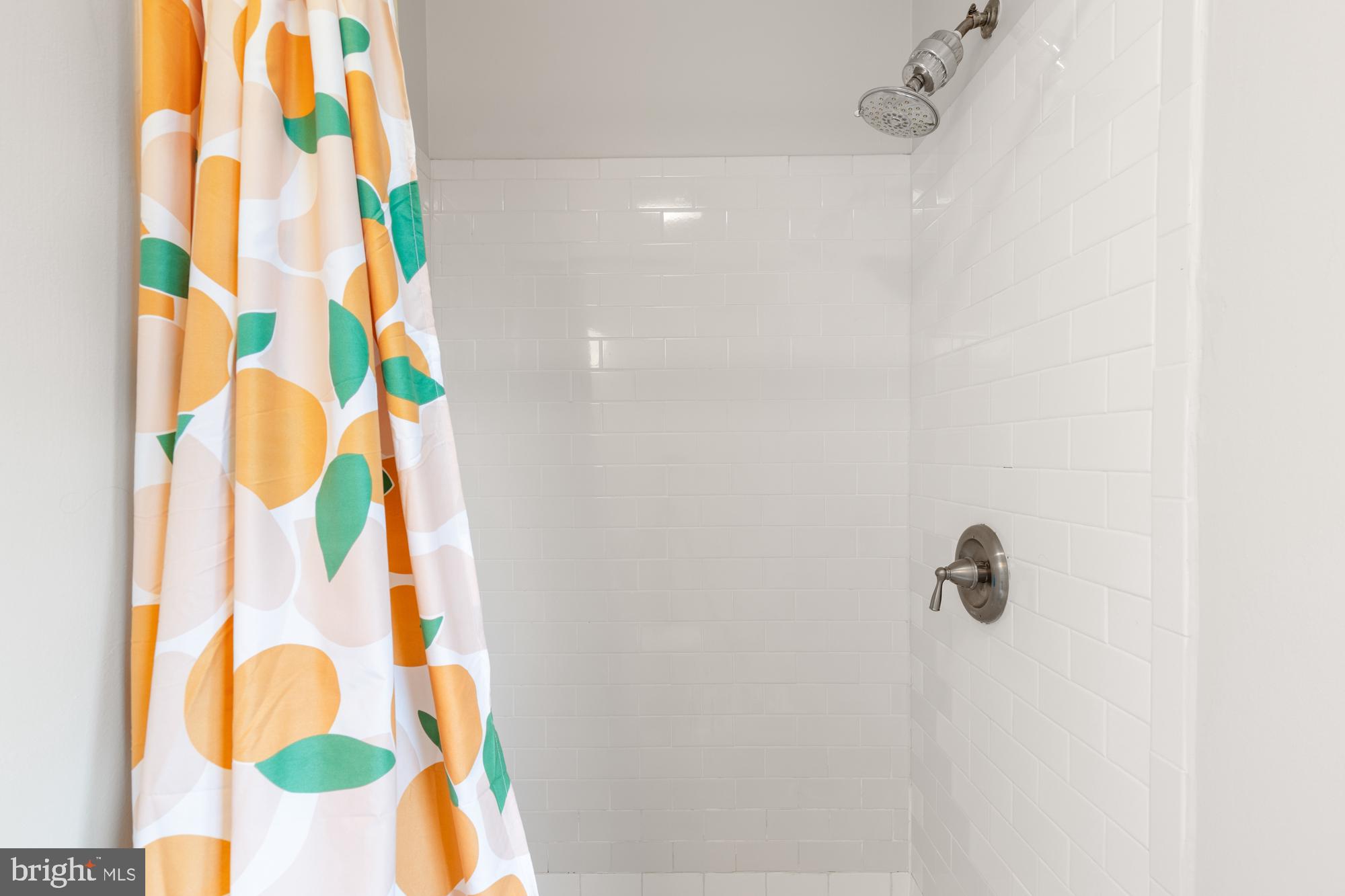 2407 Harmon Road Silver Spring, MD 20902 - Photo 29 of 39 a bathroom with a shower curtain