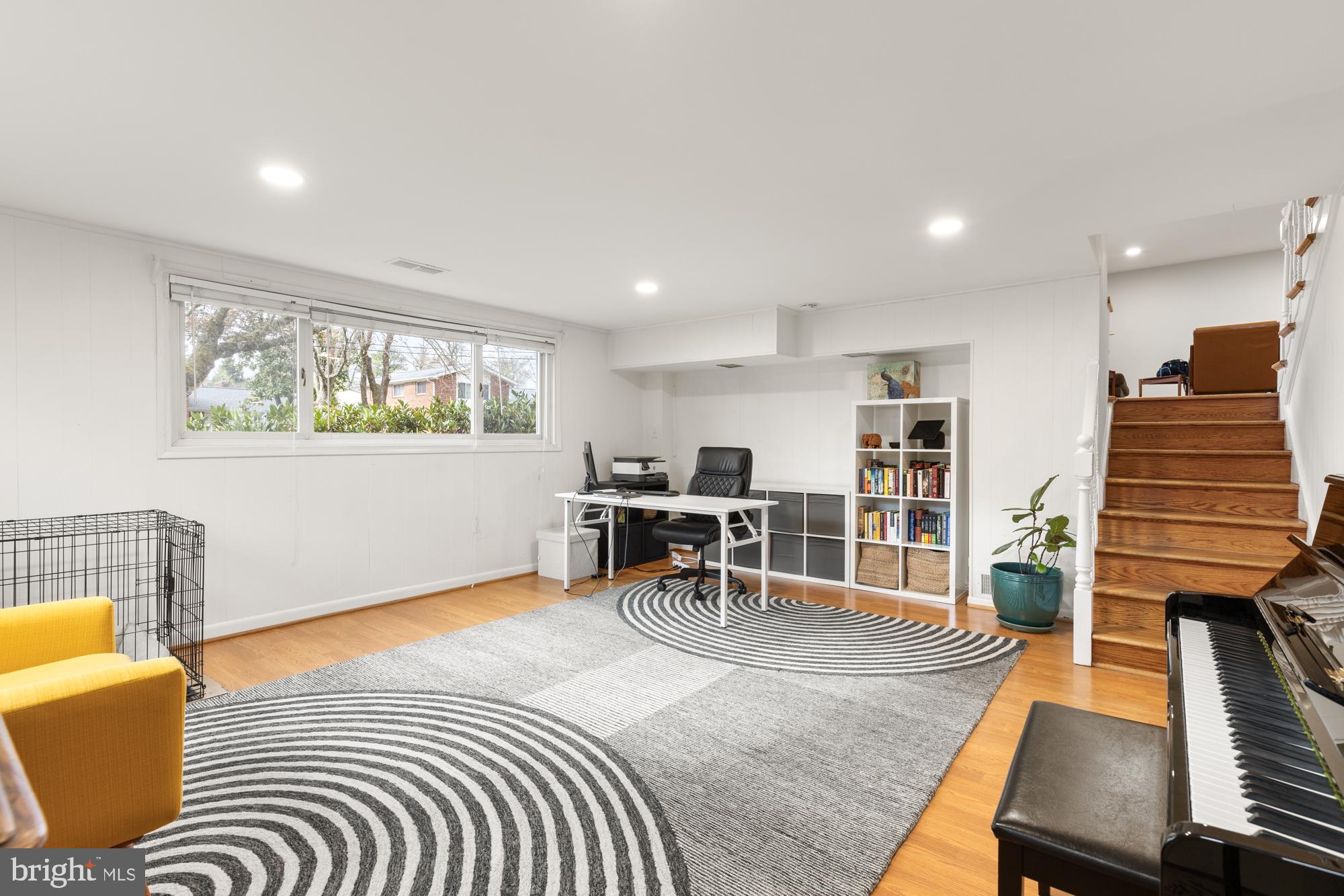 2407 Harmon Road Silver Spring, MD 20902 - Photo 31 of 39 a bedroom with furniture and a wooden floor