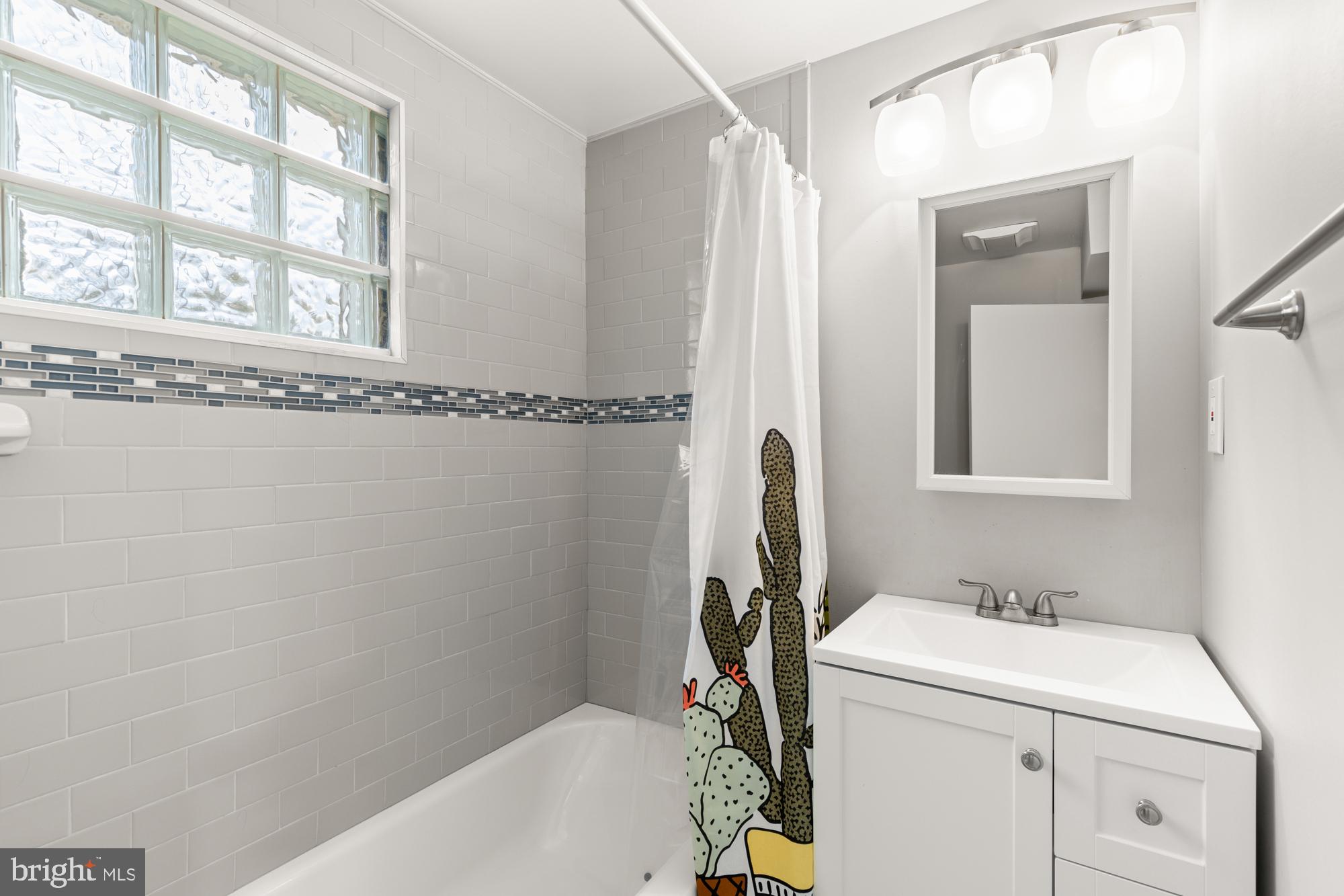 2407 Harmon Road Silver Spring, MD 20902 - Photo 36 of 39 a bathroom with a sink a toilet and a bathtub