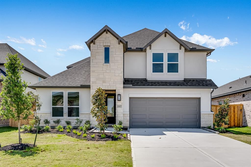 21827 Wycombe Ter Way Cypress, TX 77433 - Photo 1 of 41 a front view of a house with yard and garage