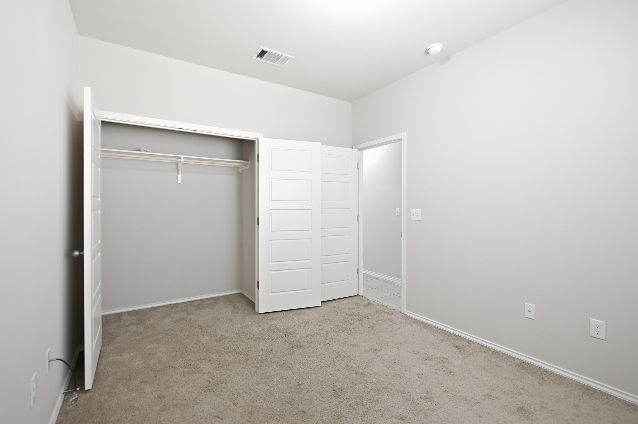 1733 Davidson Ranch Road Georgetown, TX 78626 - Photo 23 of 33 Soft carpeting pairs with neutral walls in this versatile bedroom complete with a built-in closet.