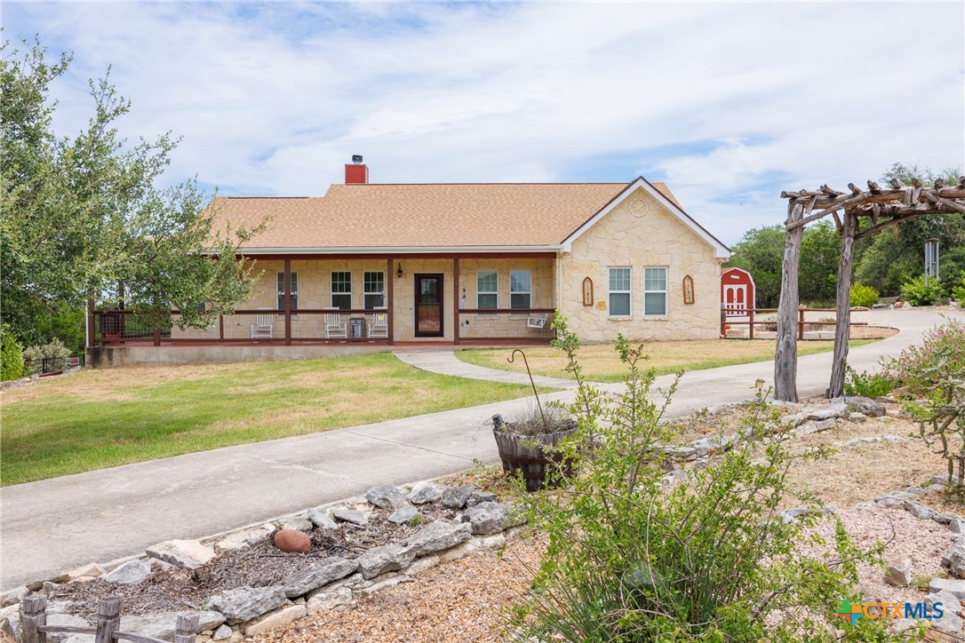 845 Rutherford Fischer, TX 78623 - Photo 1 of 39 a front view of a house with swimming pool and porch