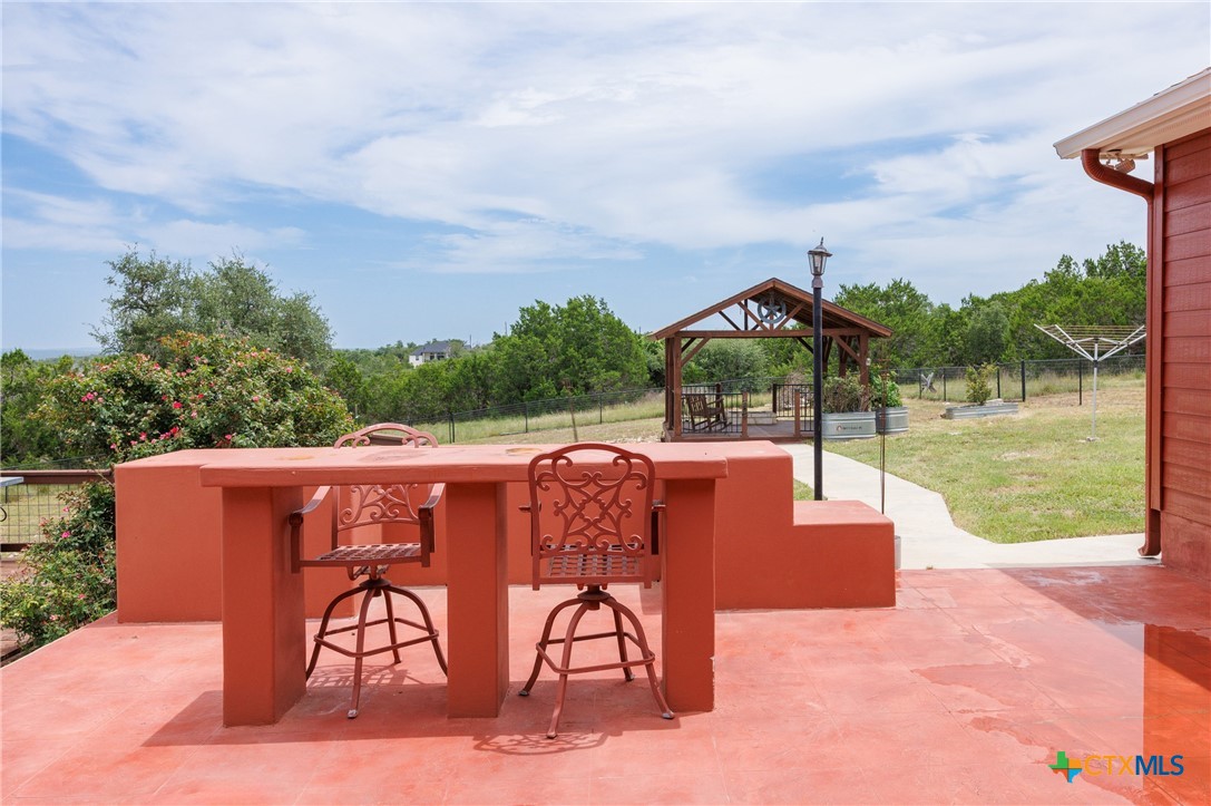 845 Rutherford Fischer, TX 78623 - Photo 24 of 39 a view of a chairs and table in the terrace