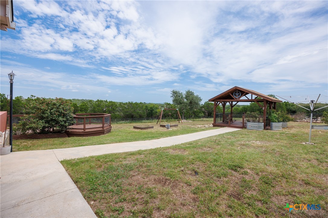 845 Rutherford Fischer, TX 78623 - Photo 35 of 39 a view of a garden and basketball court