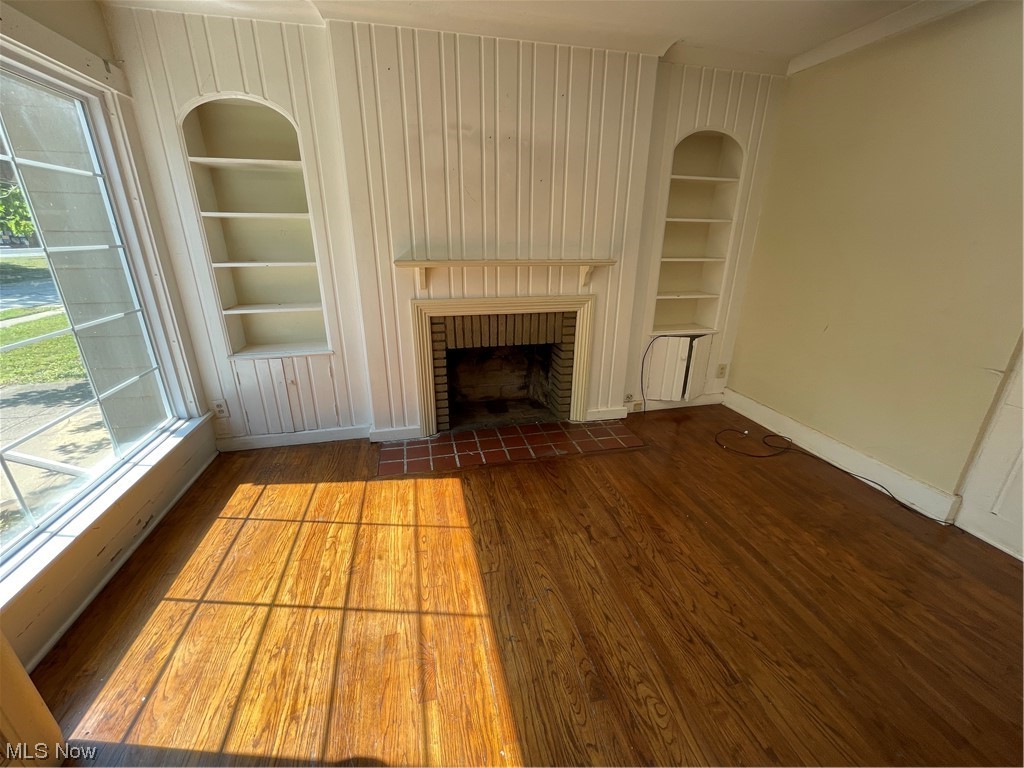 1730 Wood Road Cleveland Heights, OH 44121 - Photo 7 of 34 Hardwood floored living room with built in features and a fireplace