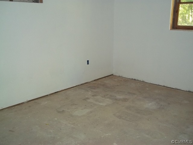 4418 Tatum Road Disputanta, VA 23842 - Photo 8 of 8 an empty room with windows