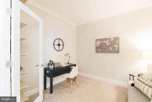 a view of a room with a table and a chair