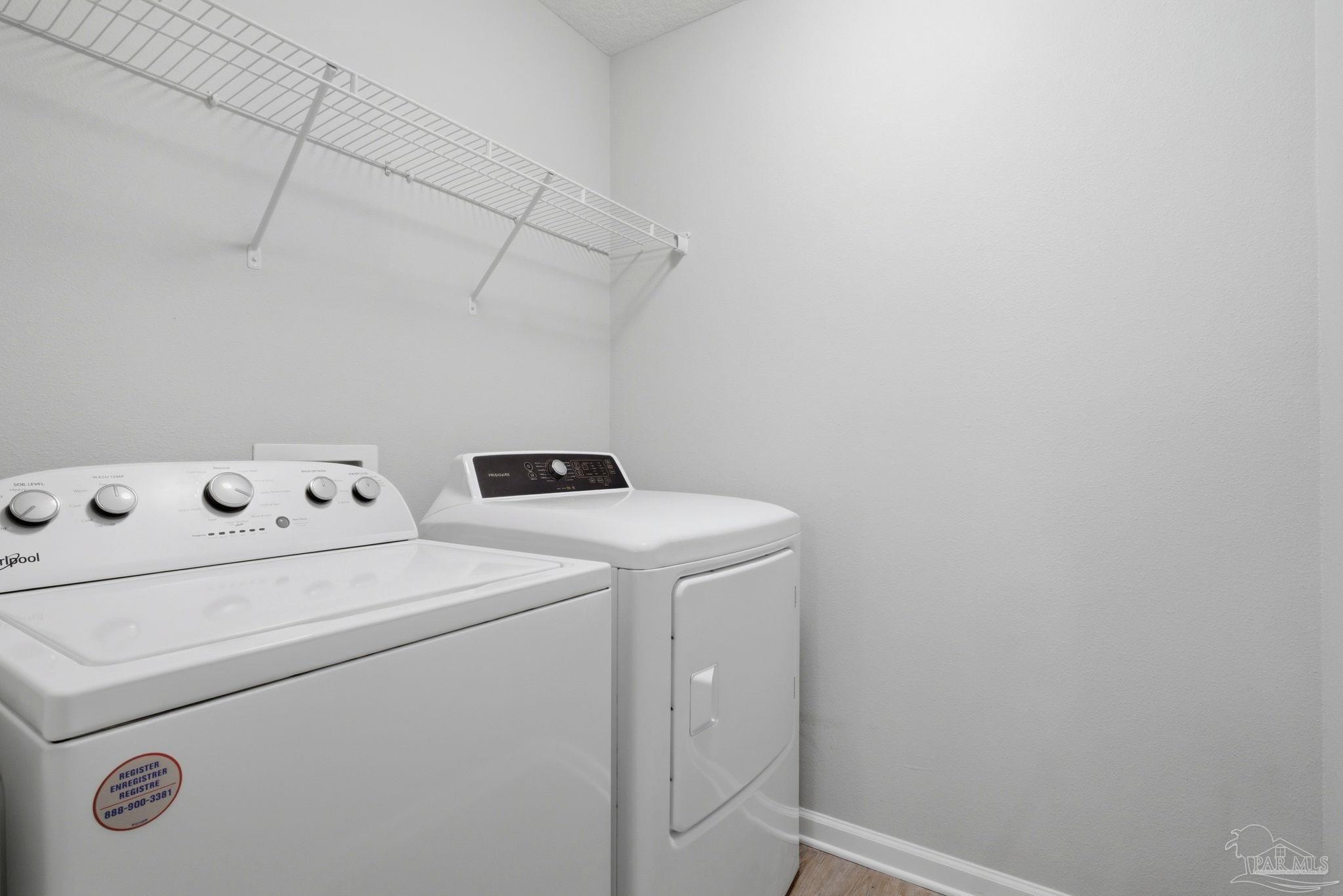 5881 Bay Tree Court Milton, FL 32570 - Photo 29 of 51 a utility room with dryer and washer