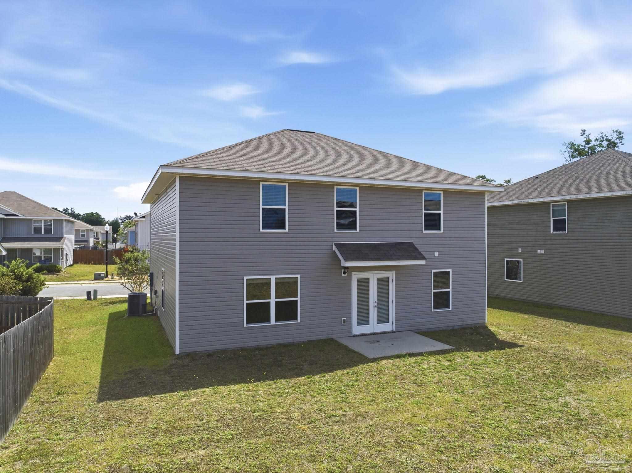 5881 Bay Tree Court Milton, FL 32570 - Photo 31 of 51 a view of a house with a yard