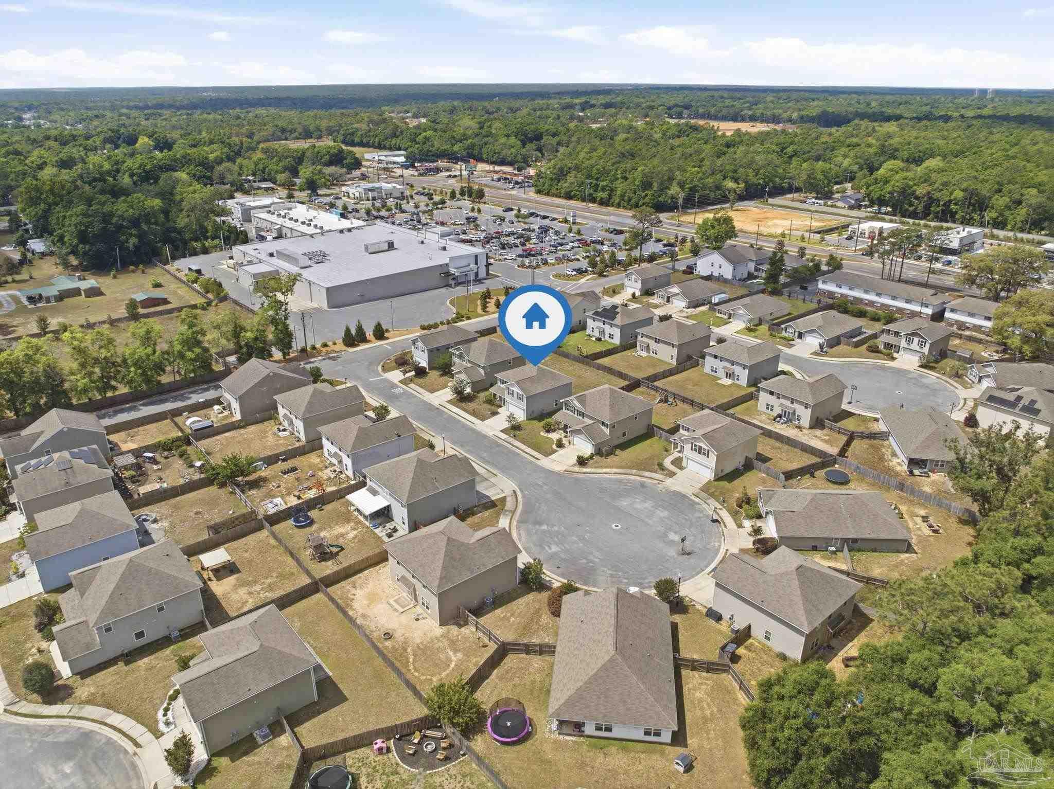 5881 Bay Tree Court Milton, FL 32570 - Photo 42 of 51 an aerial view of a city with lots of residential buildings
