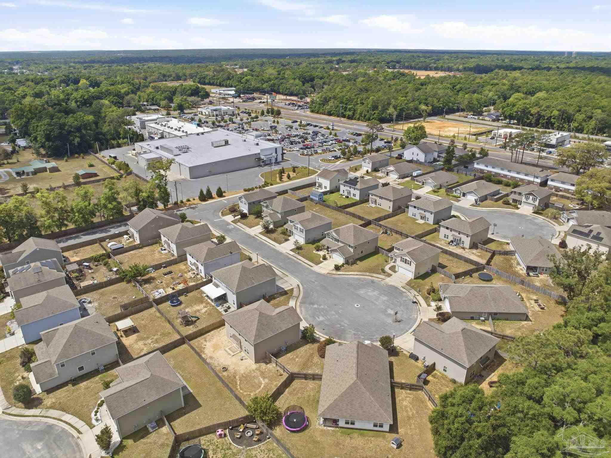 5881 Bay Tree Court Milton, FL 32570 - Photo 43 of 51 an aerial view of a city with lots of residential buildings
