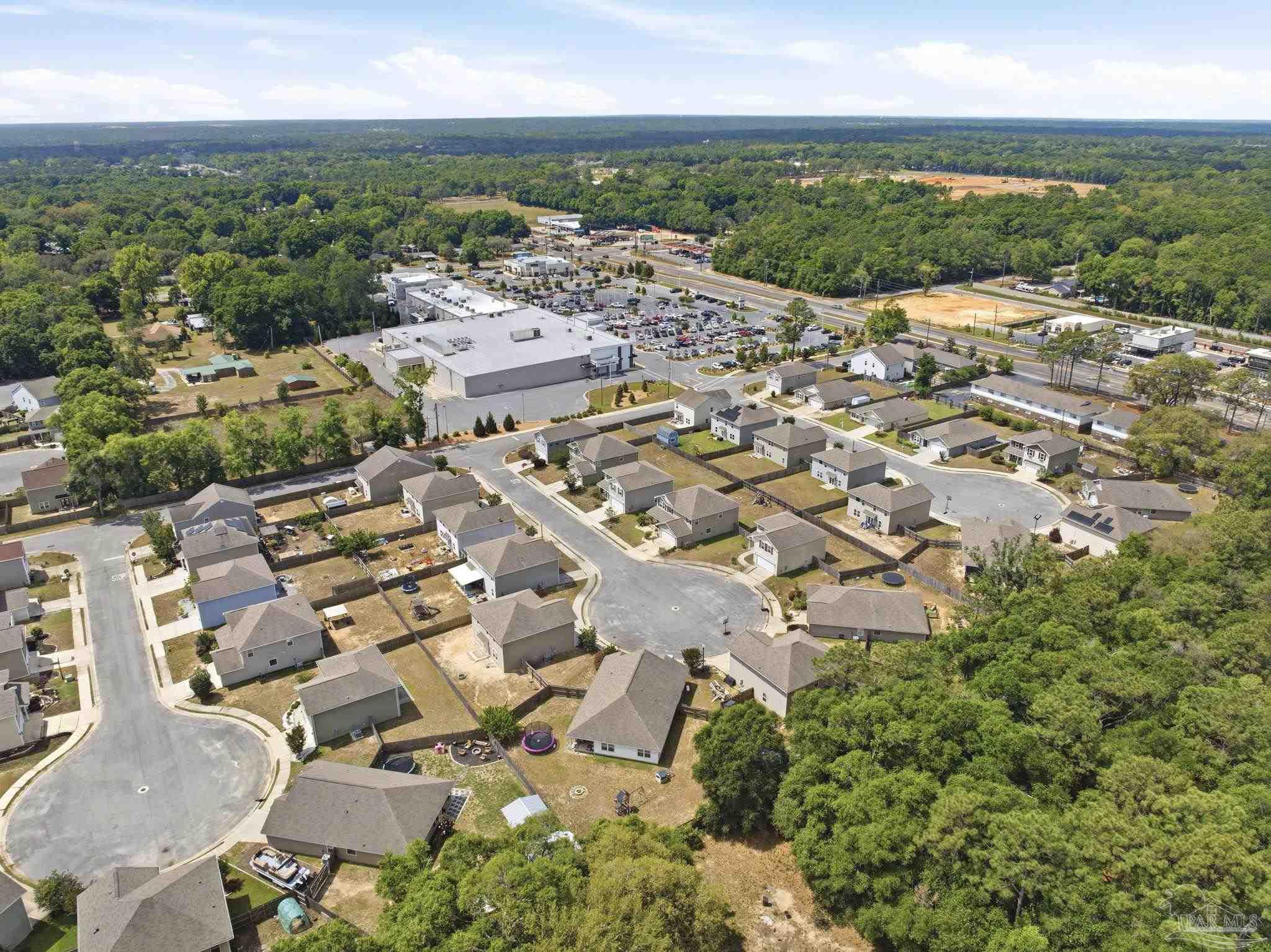 5881 Bay Tree Court Milton, FL 32570 - Photo 45 of 51 an aerial view of residential houses with outdoor space