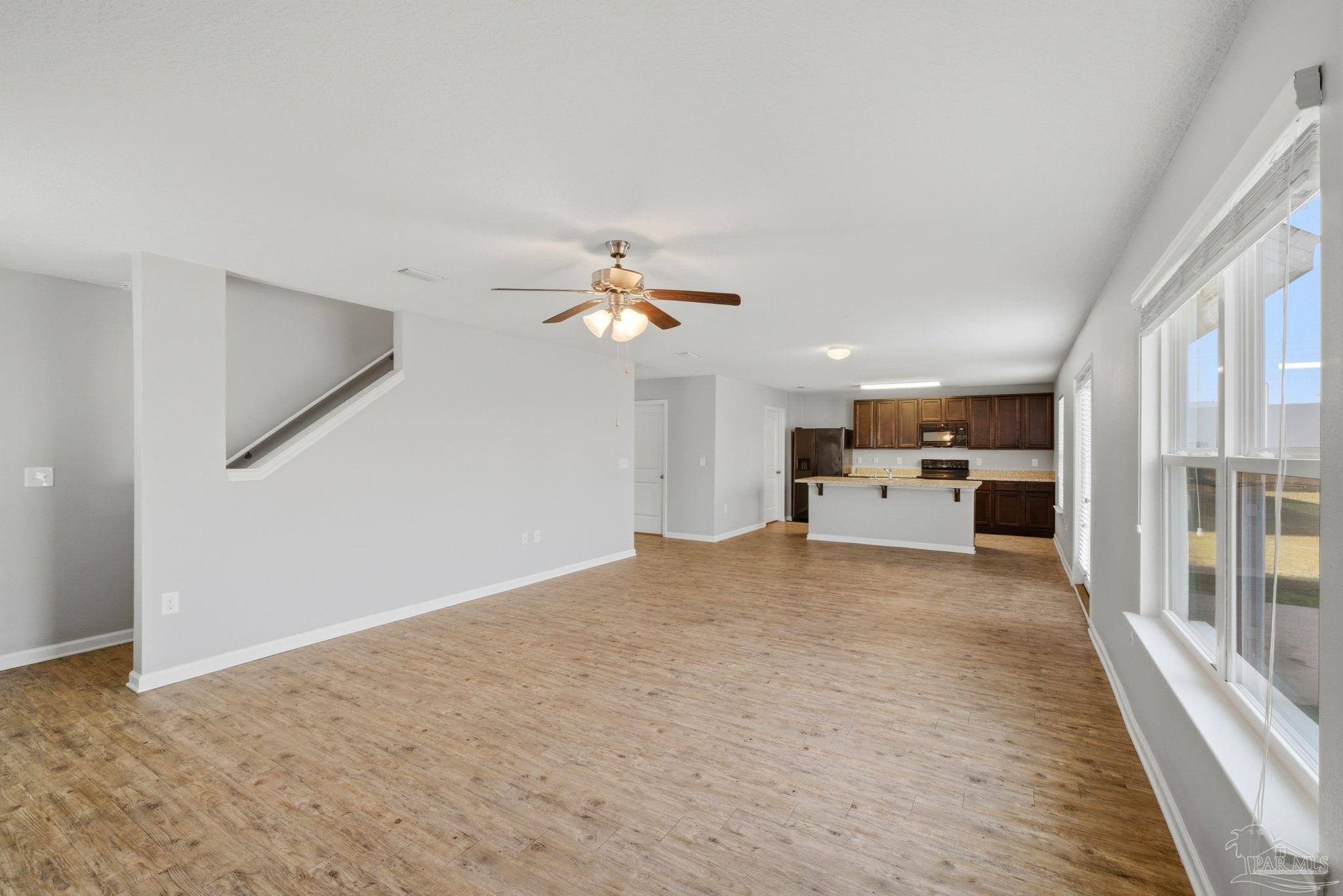 5881 Bay Tree Court Milton, FL 32570 - Photo 8 of 51 a view of a livingroom with a ceiling fan