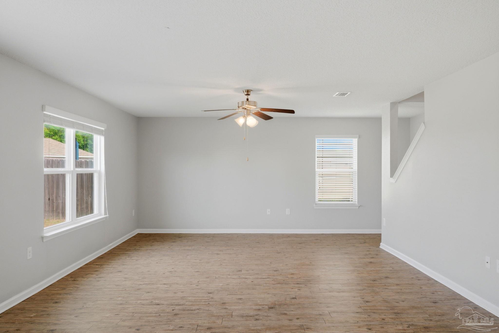 5881 Bay Tree Court Milton, FL 32570 - Photo 9 of 51 a view of a livingroom with a ceiling fan and window