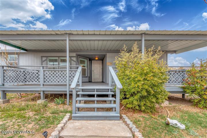 4120 East Beaver Creek Road Rimrock, AZ 86335 - Photo 1 of 31 a front view of a house with a yard